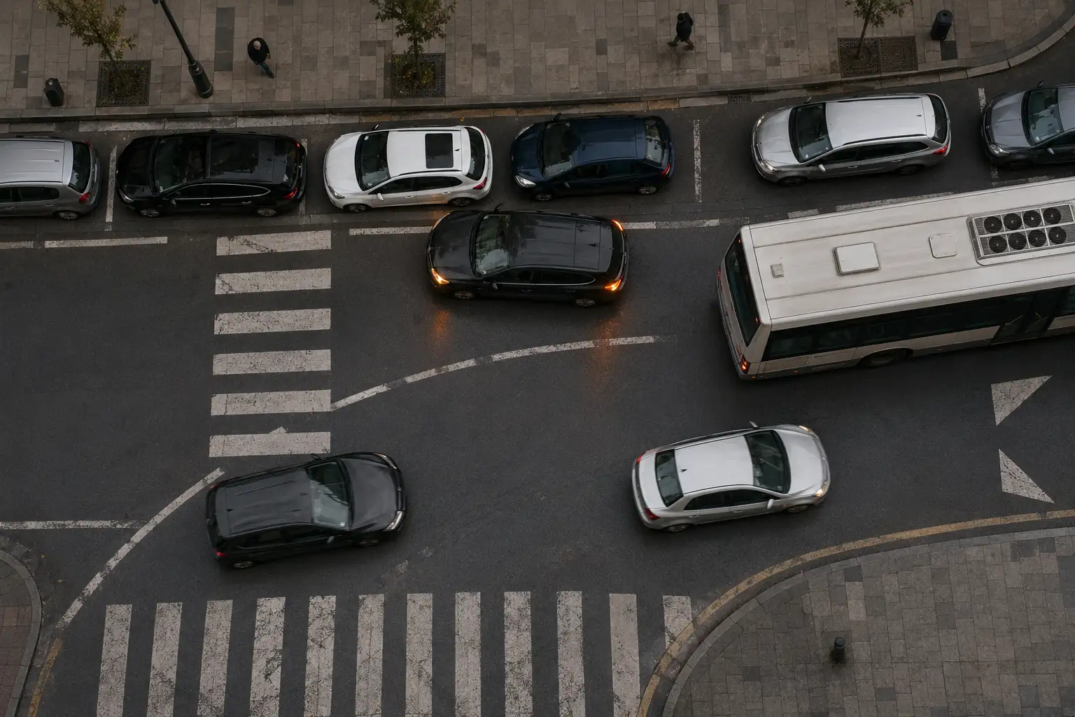 Bird’s-eye view of a car double-parked in a live lane blocking traffic, unrecorded before automated enforcement